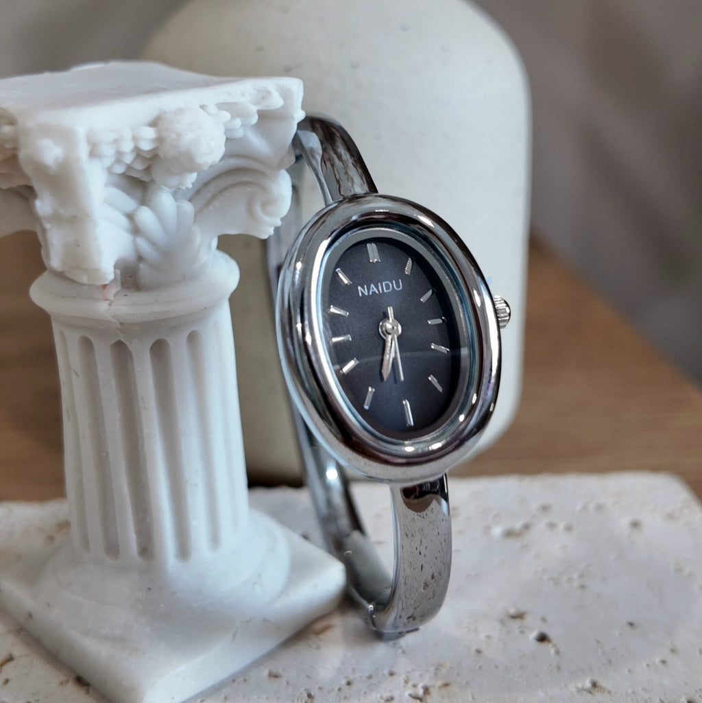 Silver with black dial bangle watch