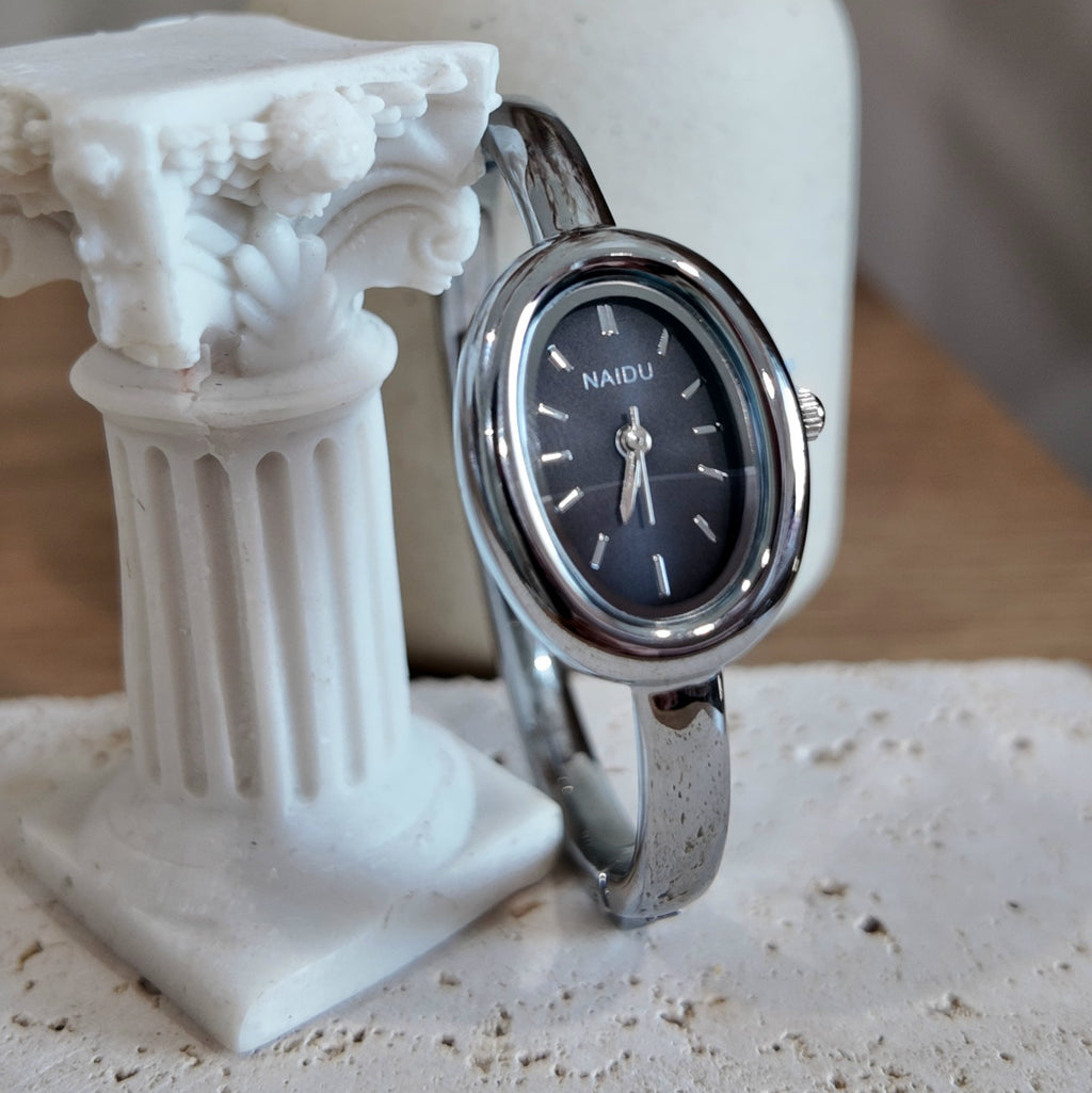 Silver with black dial bangle watch