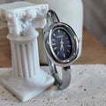 Silver with black dial bangle watch