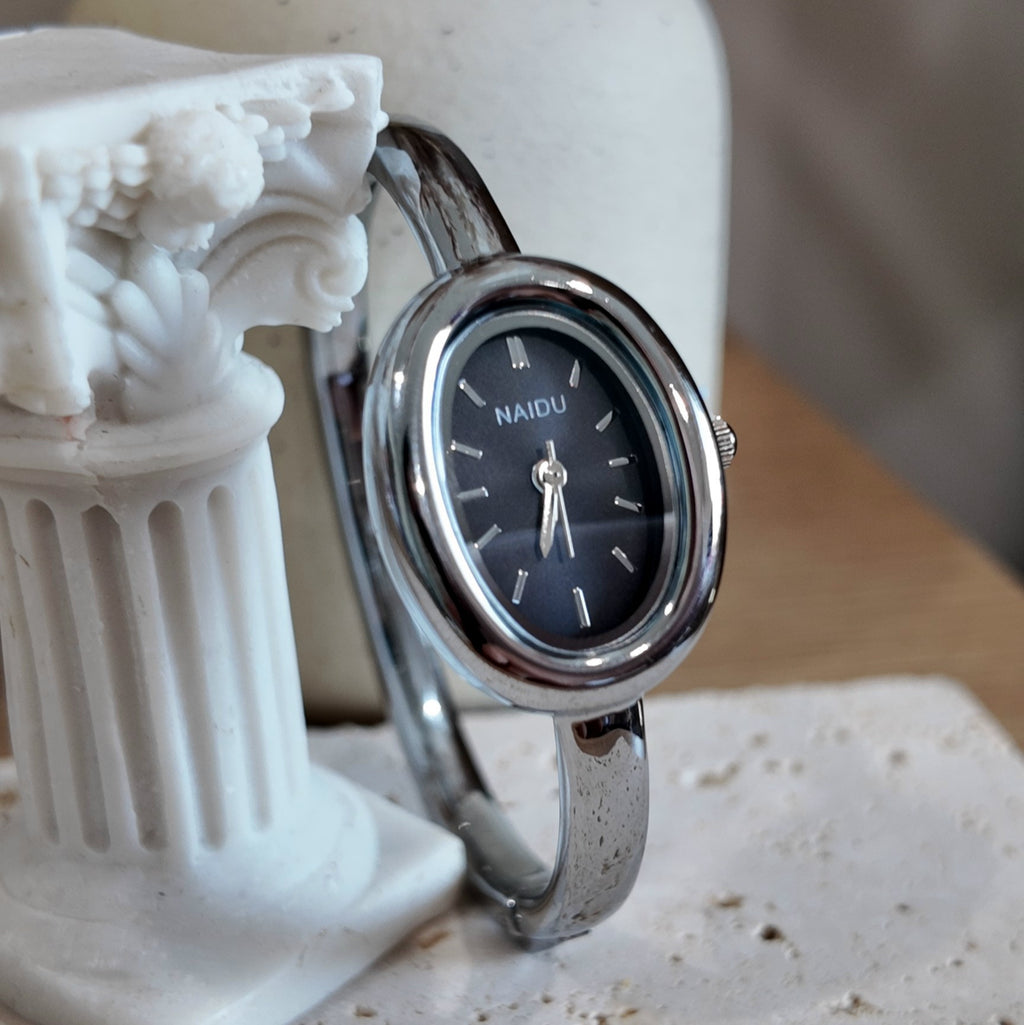 Silver with black dial bangle watch
